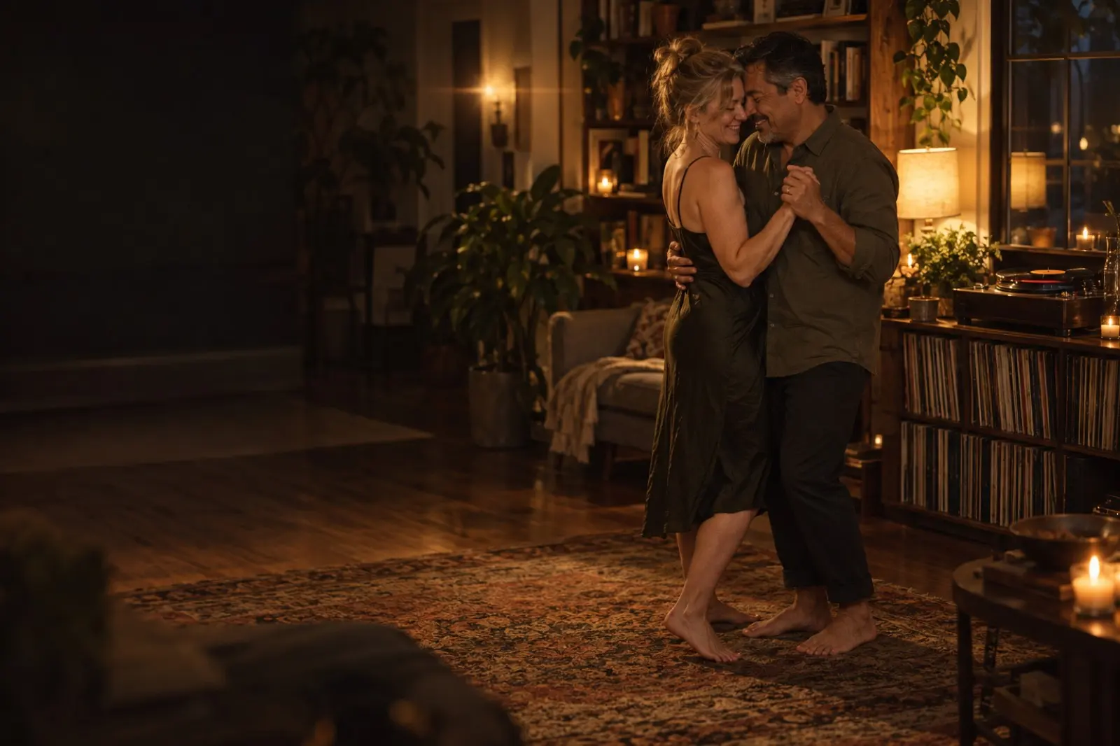 A made-up couple slow-dancing barefoot in their lamplit living room